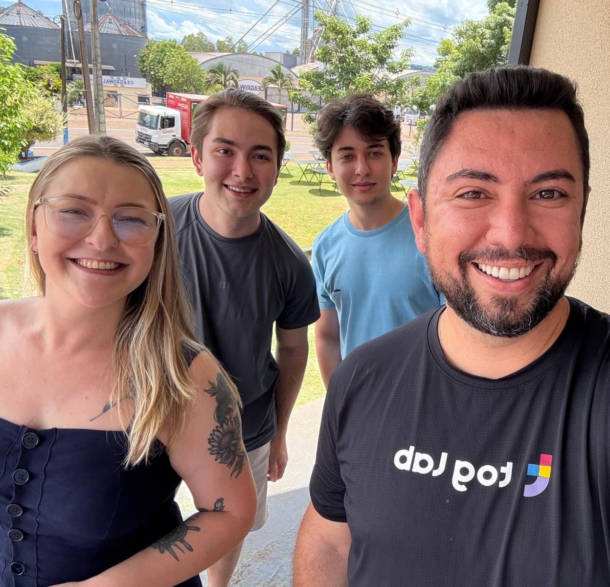 Team Toglab. Four people smiling in an outdoor selfie, representing the Toglab team in a relaxed setting.