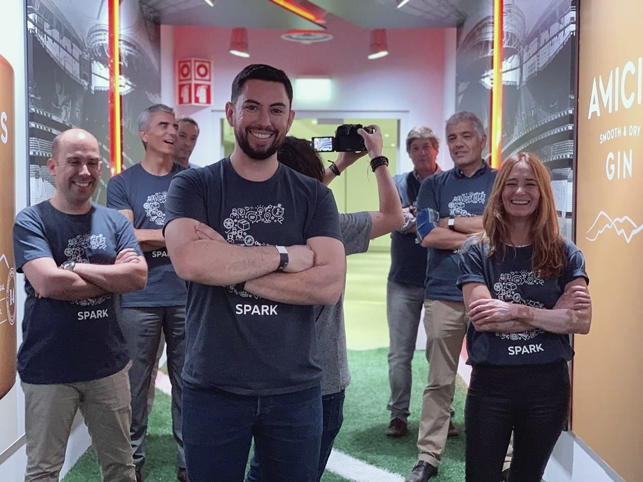Group at an innovation workshop, standing and smiling for the photo